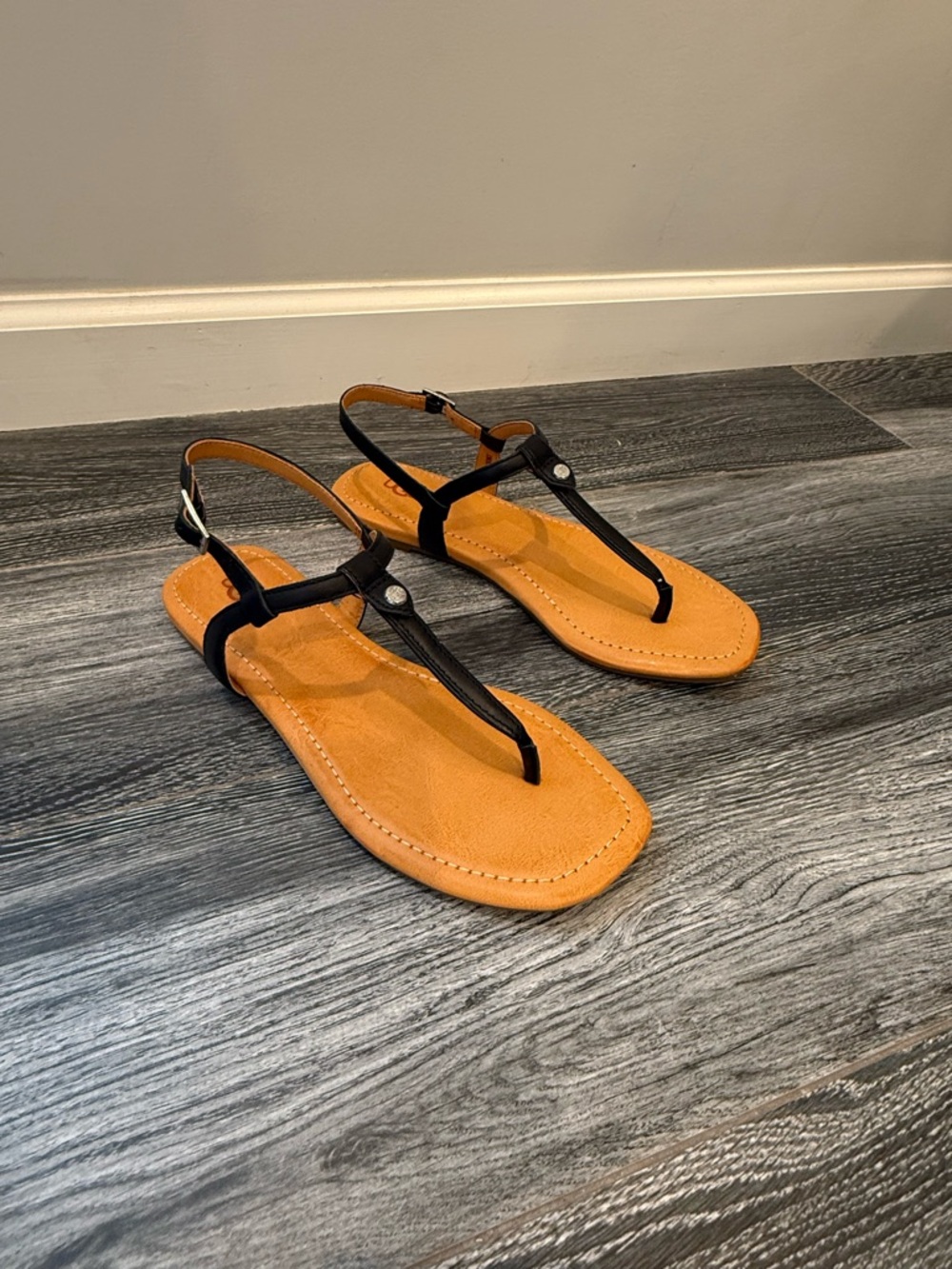 UGG Black T-Strap Sandals with Tan Footbed